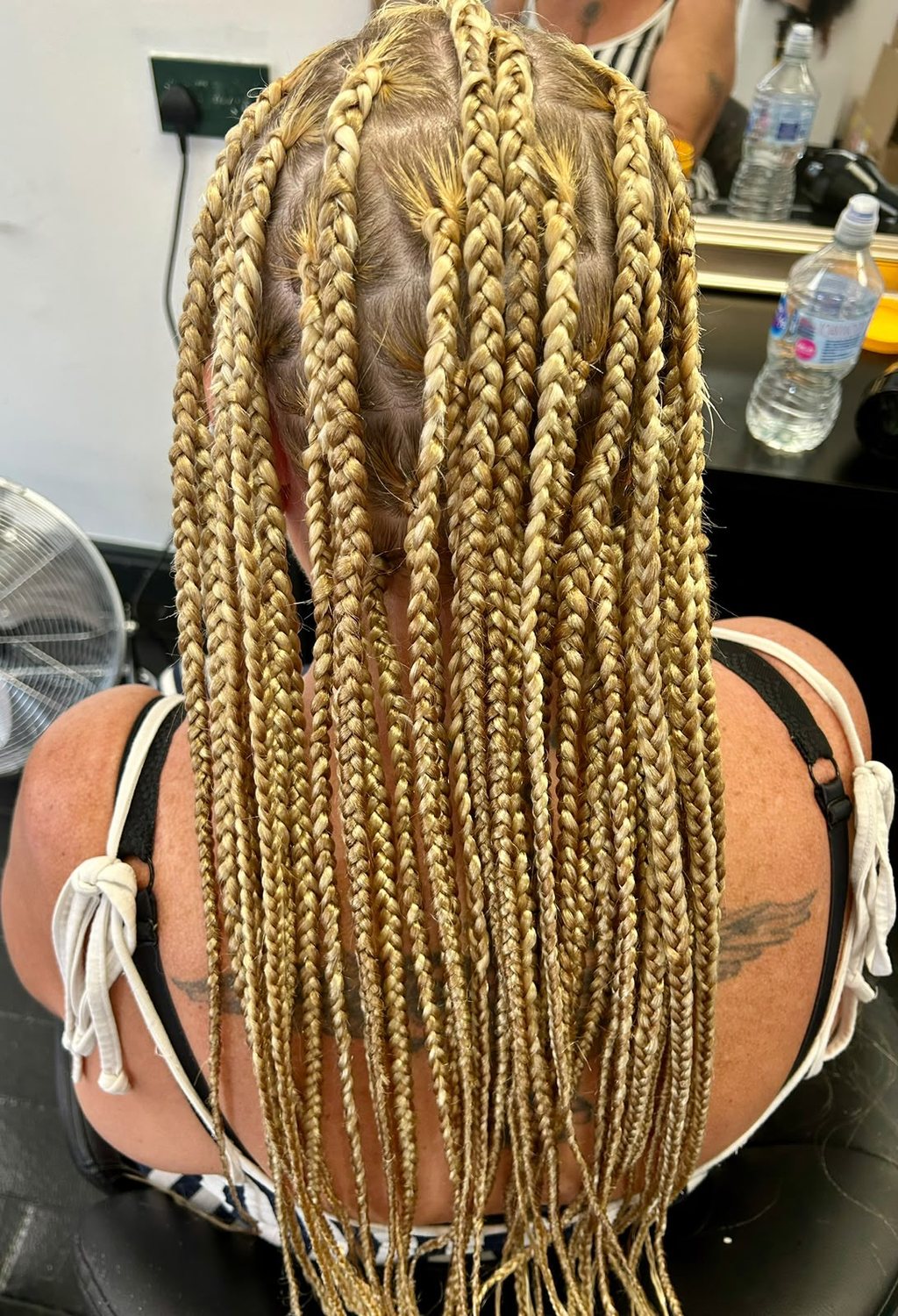 Blonde box braids, seen from behind
