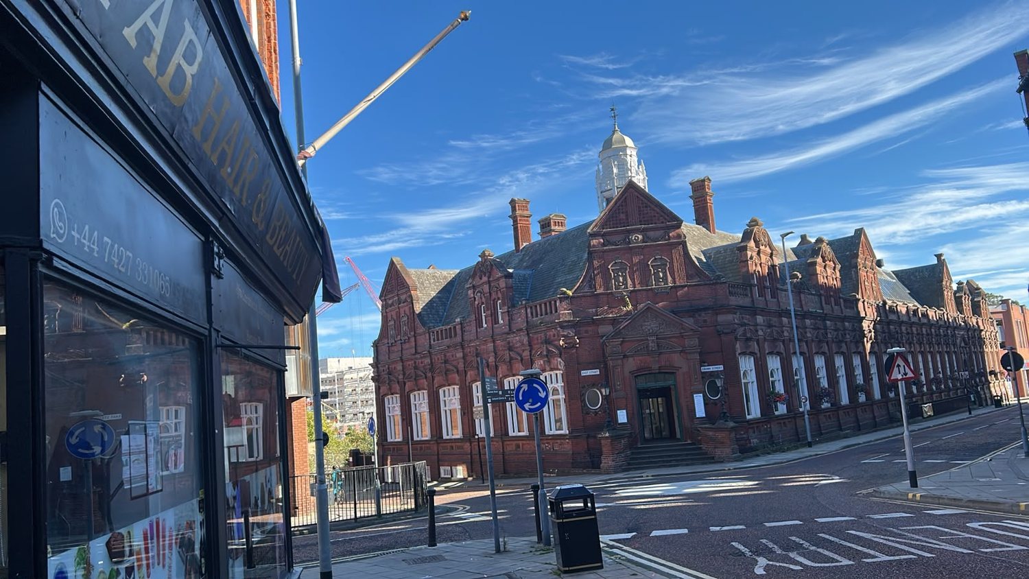 The view along Crown Street from the shop doorway, with the red brick library across the road