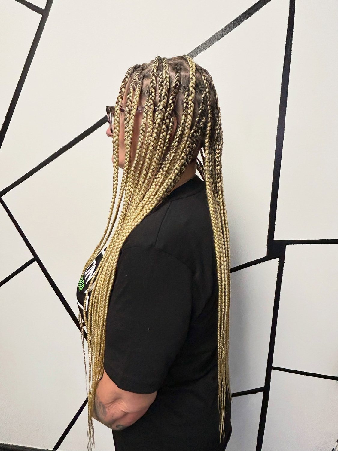 Very long blonde and brown braids, side view